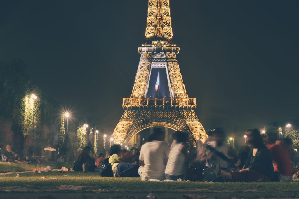 people by the Eiffel tower in Paris