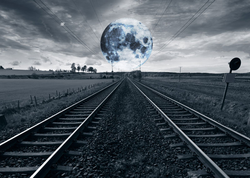 Train tracks and a full moon