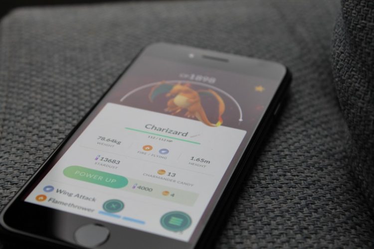 Pokemon Go open on a phone with the picture of a Charizard