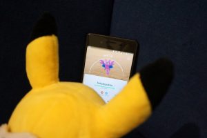 Pikachu playing pokemon go